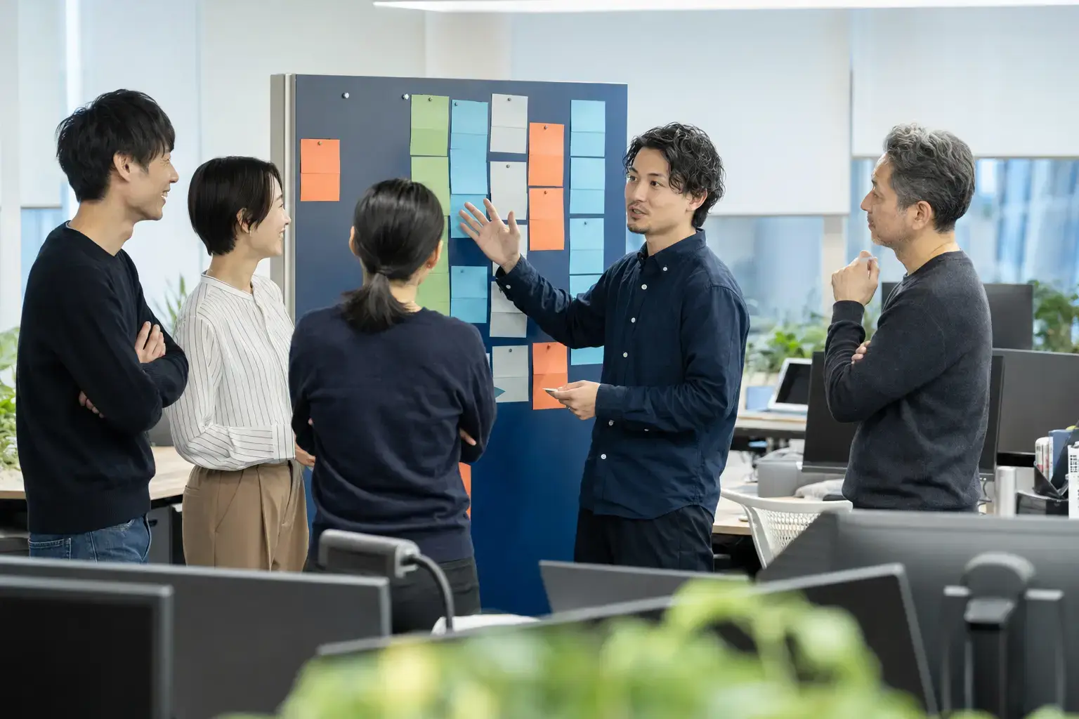 Software team holding an agile stand-up meeting