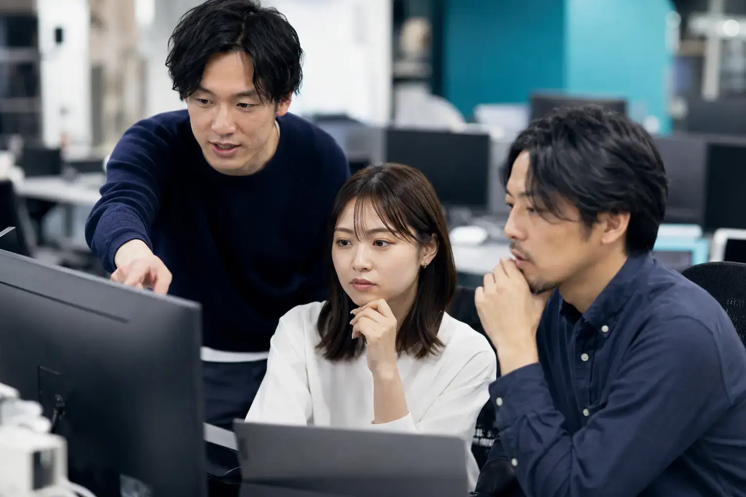 Software engineers conducting a collaborative code review