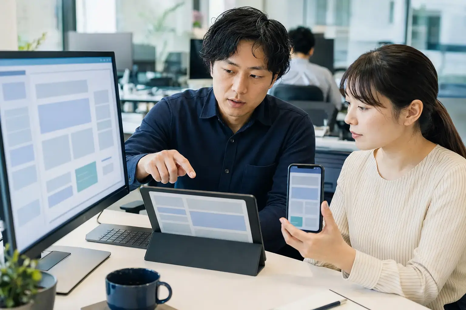 Quality engineer and developer testing software across multiple devices