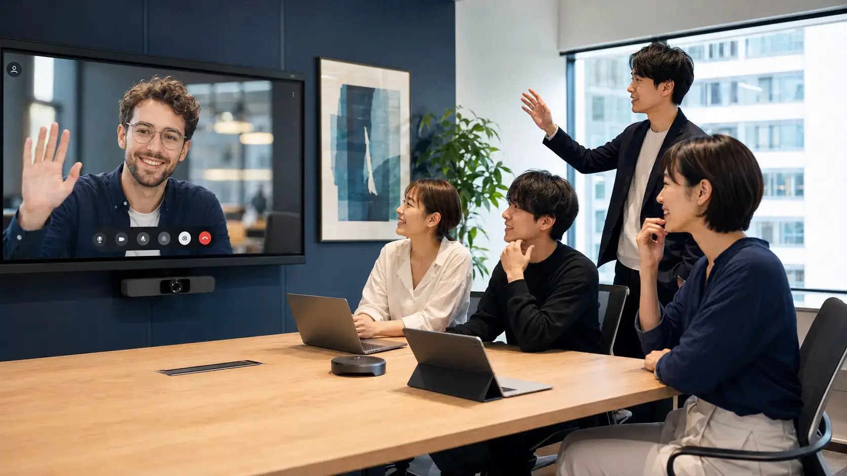 Software team collaborating with an international colleague by video